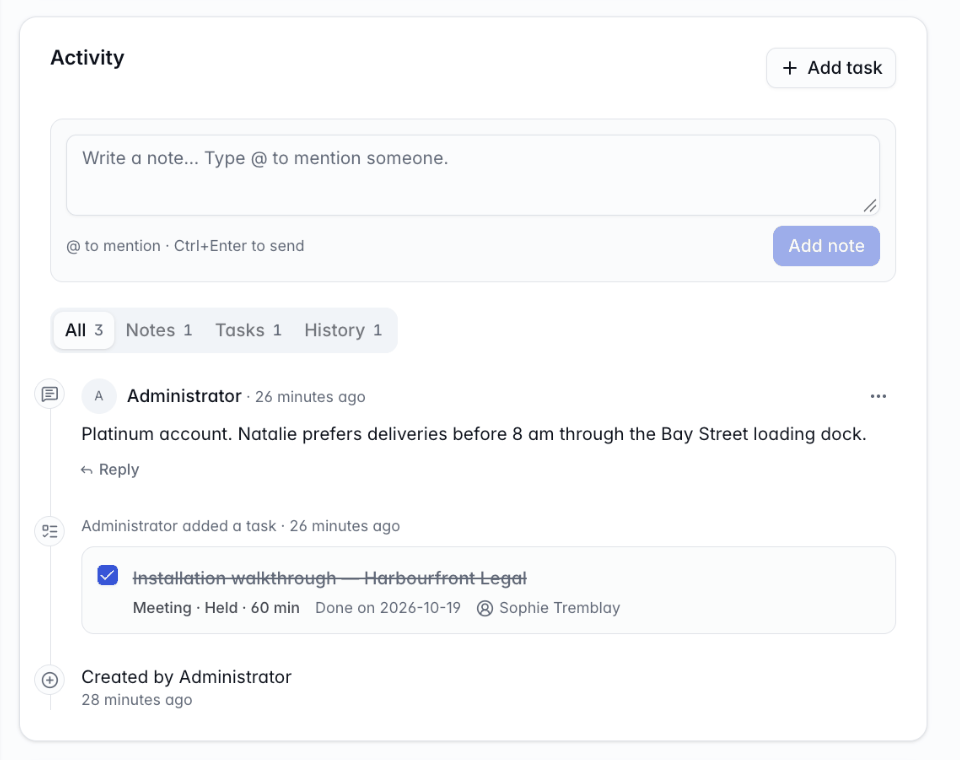 The Activity card on a company's page with a note composer, notes with a reply, tasks and history entries